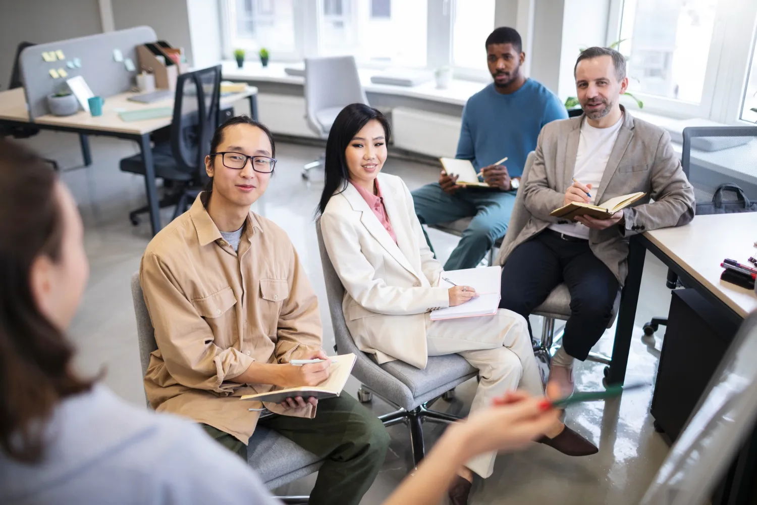 People listening to the presenter during a training