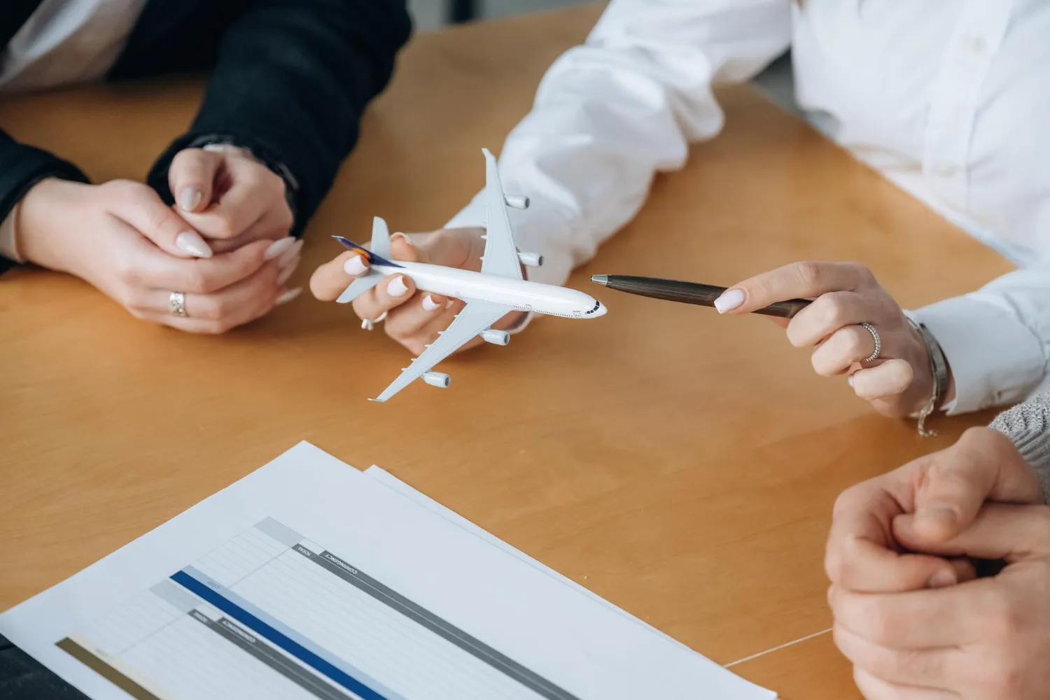 An airline trainer discussing on an airplane figure