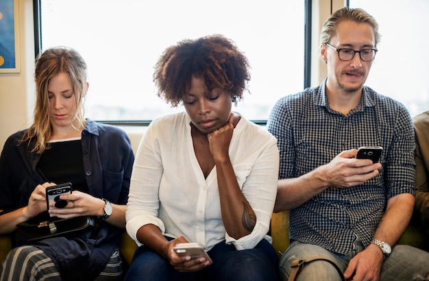 Diverse group answering questions on smartphones
