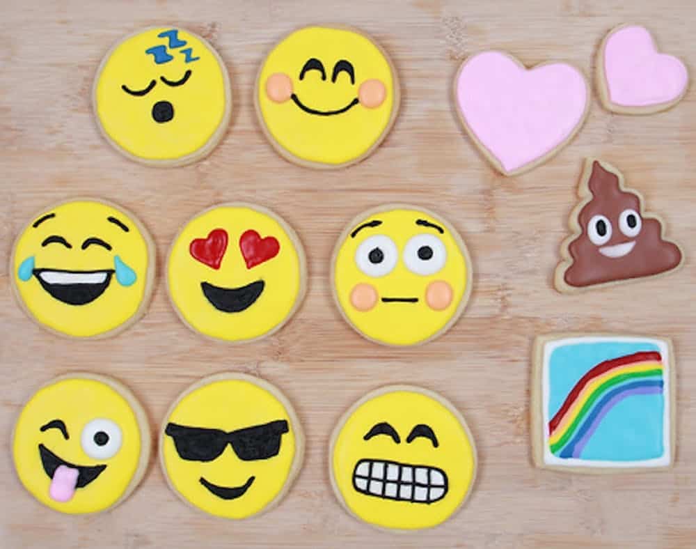 Baking emoji cookies as part of a low-key activity for a virtual party.