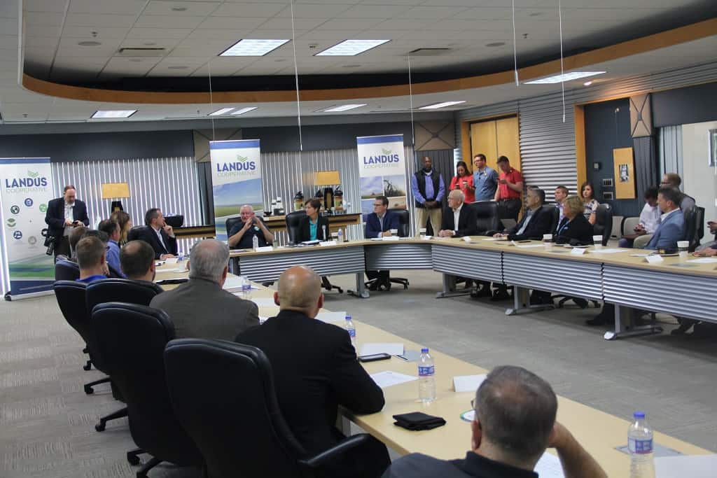 A town hall meeting at Landus coporate. Everyone sitting at a U-shape table in 2018.